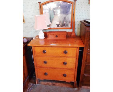 An Edwardian dressing chest, having an adjustable mirror over trinket drawer, the base with three further long drawers on pli