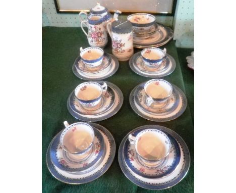 An early 20th century Booths Lowestoft Border part-tea service, comprising lidded pot, hot water jug with pewter cover, balus