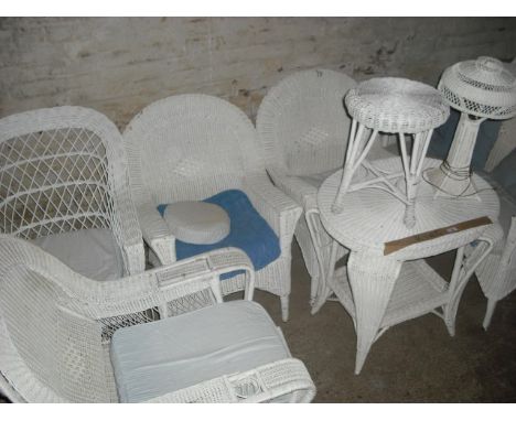 An eight piece white painted woven cane conservatory suite, comprising two person settee, four armchairs (one with integral f