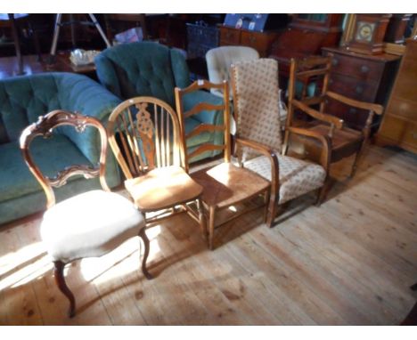 A reproduction ladder back rush seated dining chair, a wheel and stick back dining chair with elm seat, a ladder back commode