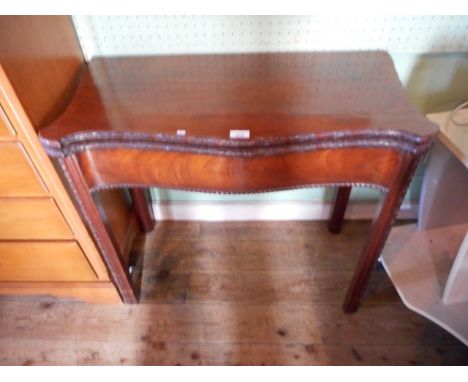 An 18th century Chippendale-style mahogany card table.