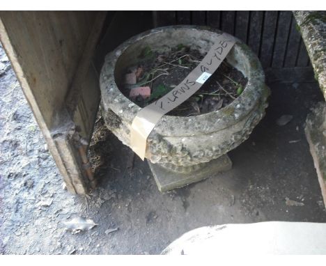 A reconstituted stone garden planter, moulded with Tudor roses on fluted column and rectangular plinth, 25cm diameter.