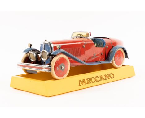 A rare 1930's No.2 Meccano Constructor Car. A boat tail example in red with blue mudguards, blue seat, red wheels with white 