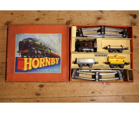 A Hornby Train Tank Goods Set No.40. An O gauge set comprising a clockwork BR 0-4-0 tank engine in lined gloss black 82011 in