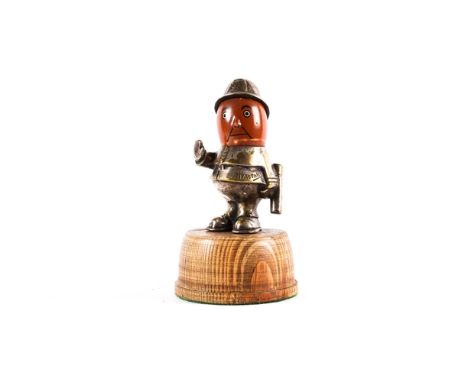 A rare  Policeman Car mascot by HASSELL, nickel plated body and helmet, ceramic head some wear to the paint work, and wear to