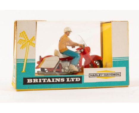 A scarce Britains 9689 Harley Davidson motorcycle in red and white with driver with light blue trousers and yellow shirt. Loo