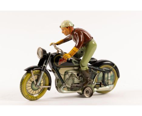An Arnold 'Mac700' tinplate clockwork Motor Cycle. In black with rider who dismounts and mounts the motor cycle. Clockwork mo