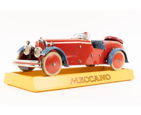 A rare 1930's No.2 Meccano Constructor Car. A round tail example in red with blue mudguards, blue seat, red wheels with white