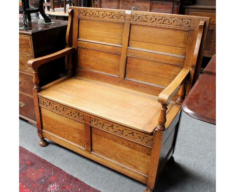 An Early 20th Century Carved Oak Monks Bench, 107cm by 54cm by 103cm