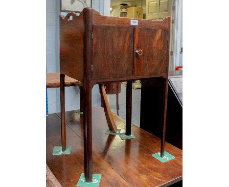 A George III Mahogany Washstand, 46cm by 36cm by 74cm The top with ring marks, the back with a slight split but otherwise ok