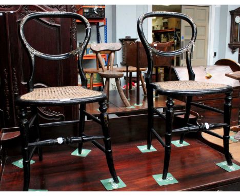 A Pair of Victorian Mother of Pearl and Black Lacquered Balloon Back Chairs, with caned seats and spindle supports