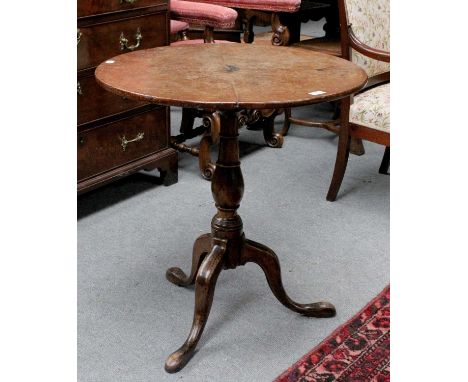 A George III Tilt-Top Tripod Table, with circular burr top, 68.5cm by 72cmThe top has been split in two and repaired, solid w