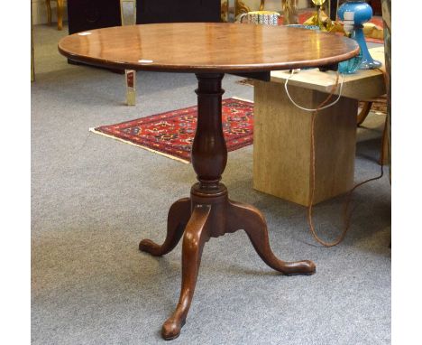 A George III Mahogany Tilt-Top Tripod Table, circular top, turned column, outswept legs, 79cm by 71cmThe one piece top is sup