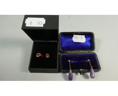 A Pair of Oval Cut Ruby Earrings Approximately .75ct Each Together with an Edwardian Pair of Drop Amethyst Earrings 