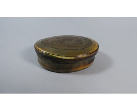 A 19th Century Oval Horn Snuff or Tobacco Box the Oval Top Decorated in Relief with Battle Scene, 10cm Long 