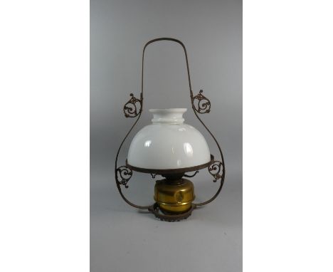 A Late 19th Century Oil Lamp with Brass Reservoir in Wrought Iron Ceiling Hanging Frame, 64cm High 