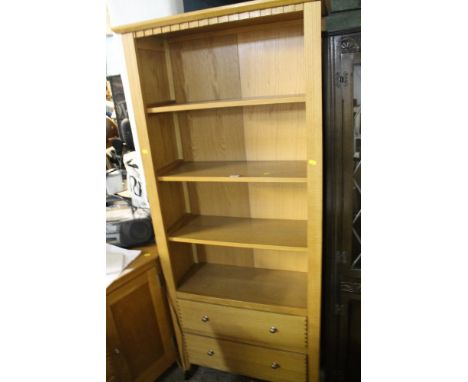 A MODERN LIGHT OAK OPEN FRONTED BOOKCASE