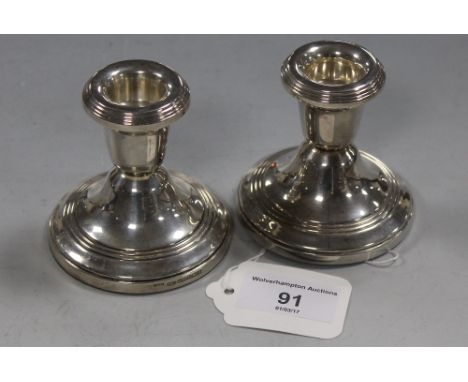A PAIR OF HALLMARKED SILVER CANDLESTICK HOLDERS