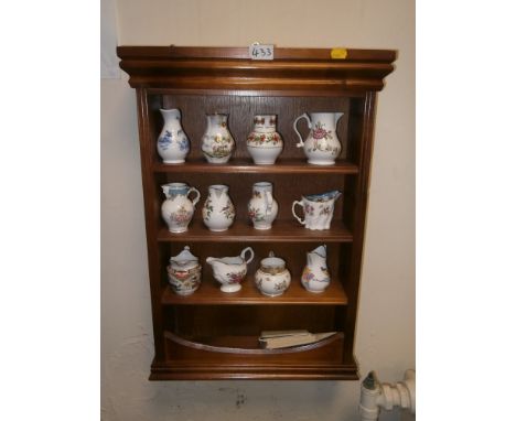 A SMALL SET OF HANGING SHELVES TOGETHER WITH A COLLECTION OF ROYAL WORCESTER JUGS