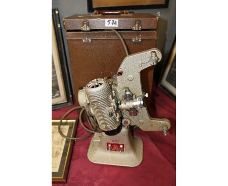 A CASED BELL AND HOWELL CINE FILM PROJECTOR