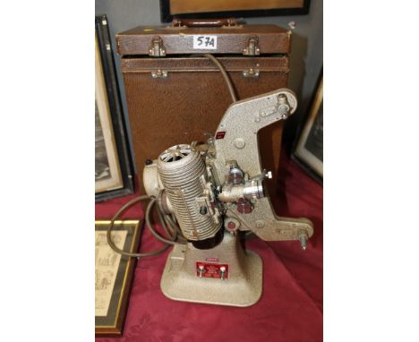 A CASED BELL AND HOWELL CINE FILM PROJECTOR