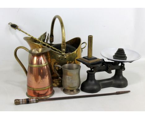 A small group of metalware including a brass coal bucket, a floral embossed wall pocket, horse brasses, copper ewer and a set