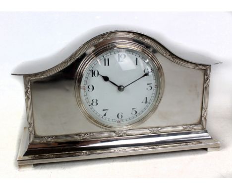 An Edwardian silver plated eight day domed mantel clock, the circular dial set with Arabic numerals, French movement, 14 x 23