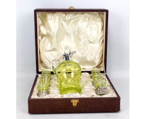 ARMY &amp; NAVY COOPERATIVE SOCIETY LTD; a cased Edward VII hallmarked silver and cut green glass liqueur set, comprising dec