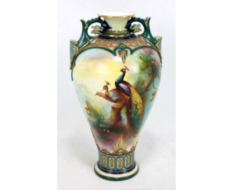 ROYAL WORCESTER; an early 20th century hand painted and gilt heightened baluster vase, with flared rim and twin scrolling han