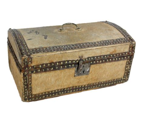 A late 18th/early 19th century domed pony skin covered and brass stud decorated lidded casket with central carrying handle an