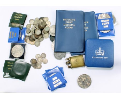 A small group of pre and post 1947 British coinage to include Elizabeth II Silver Jubilee commemorative crowns, two sets of '