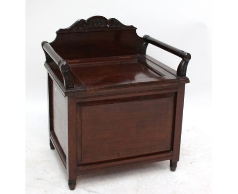 A late Victorian simulated mahogany commode raised on turned peg supports, width 55cm.