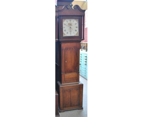 A 19th century oak cased longcase clock with broken swan neck pediment and brass finial above circular dial set with Roman nu