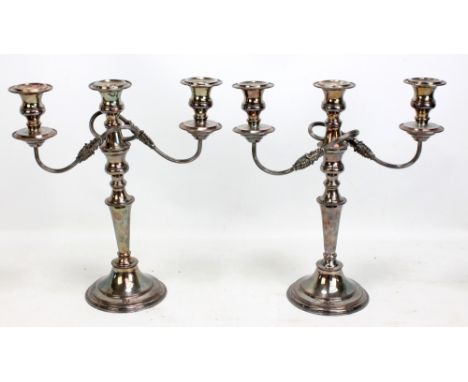 A pair of silver plated three light twin branch candelabra with detachable sconces convertible to a pair of candlesticks, hei