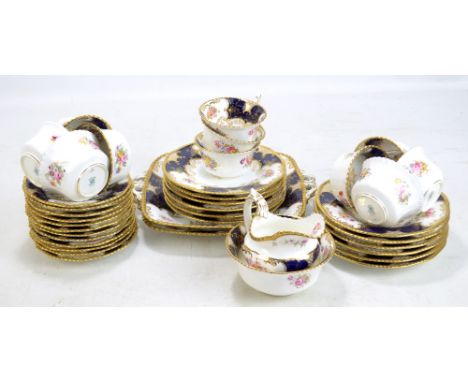 COALPORT; a floral and gilt decorated part tea set comprising tea cups and saucers, side plates, sandwich plates, milk jug, s