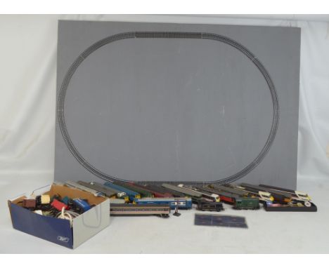 A group of loose Hornby, Lima and Tri-ang diesel locomotives, three carriages, group of rolling stock and various empty boxes
