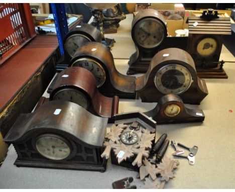 Eight early 20th century and later mantel clocks including domed examples, the tallest 33cm, and a modern cuckoo wall clock (