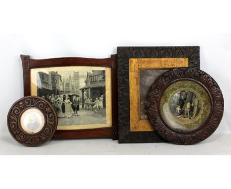 Three Macclesfield School of Carving picture frames comprising one rectangular and two circular examples, the first 44 x 38.5