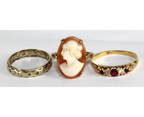 A yellow metal, diamond and ruby five stone ring (hallmark illegible), size R, a cameo ring, and an unmarked example, weighab