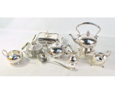 A small group of electroplated items comprising a four piece tea set including a spirit kettle on stand, an entree dish with 