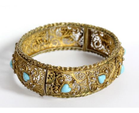 A Portuguese 833 grade silver gilt filigree bangle inset with turquoise hearts, hallmarked for Oporto, aperture 7cm.Additiona