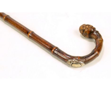 A late Victorian gadget walking stick with bamboo shaft and internal horse measuring stick, unnamed, length 90cm.Additional I