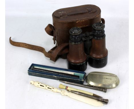 A pair of early 20th century binoculars by Dollond of London in fitted leather case, a carved bone letter opener, a collectio