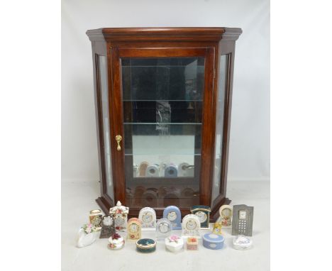 A collection of miniature predominantly ceramic mantel clocks including Royal Crown Derby and Royal Doulton examples, various