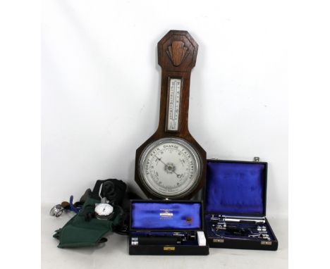 A small group of scientific instruments comprising oak barometer and thermometer, cased Hamblin of London opthalmoscope, a fu