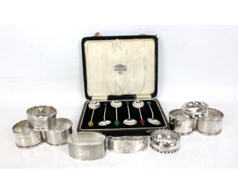 Eight variously hallmarked silver napkin rings to include an engine turned decorated example, Francis Howard, Birmingham 1978