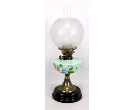 A late 19th century Art Nouveau brass oil lamp, with painted green glass font and etched shade, height 58cm.Additional Inform
