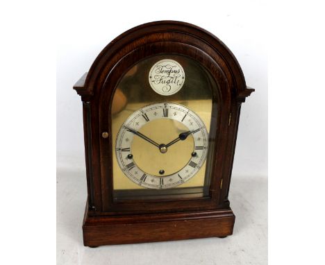 A mahogany cased Westminster chime mantel clock, the silvered chapter rings set with Roman and Arabic numerals below 'Tempus 