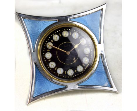 A French silver and engine turned guilloche enamel eight day timepiece, the similarly enamelled dial set with gilt Arabic num