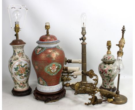 Three decorative ceramic table lamps, height of largest excluding fitment 40cm including base, a pair of gilt metal three bra